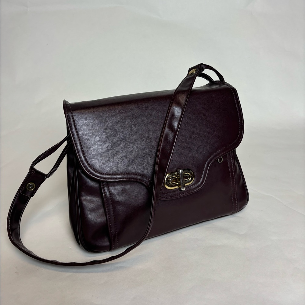 Purple/Red leather shoulder bag with gold accents